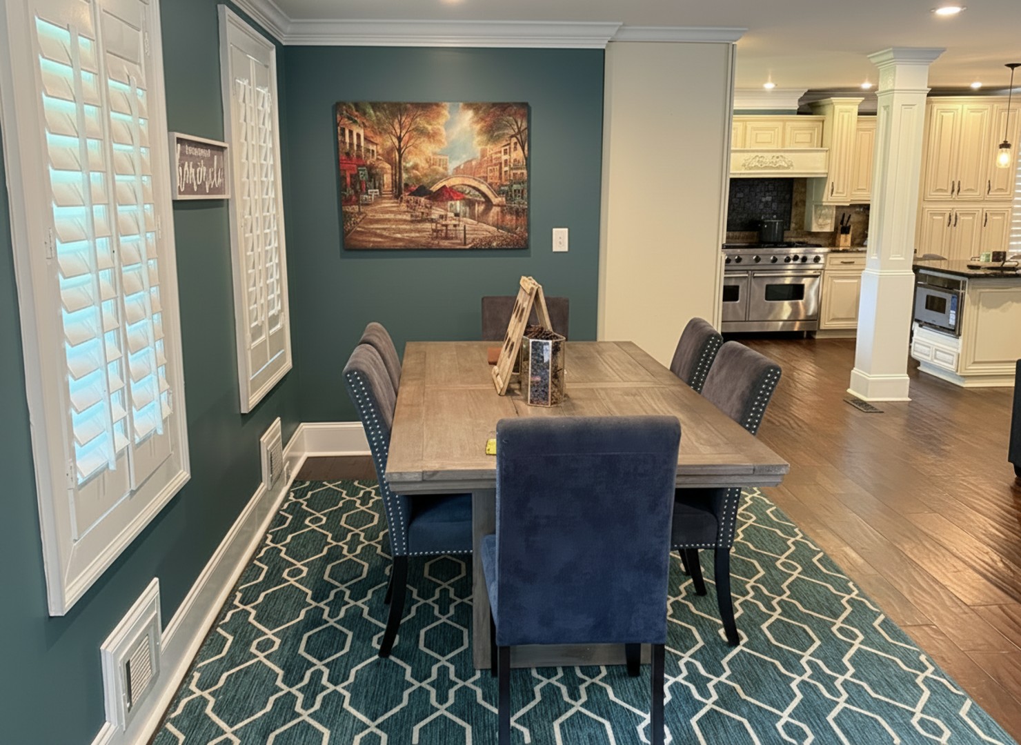 Gather around this inviting dining table for memorable meals and lively conversation, perfectly flowing into the spacious kitchen.